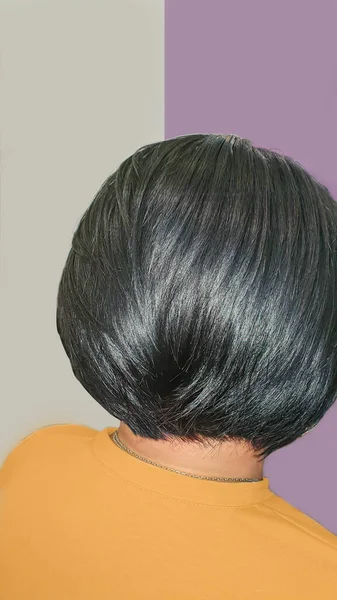 Haircut and styling in a beauty salon. Black hair. copy space.