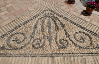 Mosaic patterns on the paved atrium in Cordoba