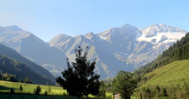Morning misty scenery of Austrian Alps                               