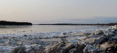 Winter ice on Mackenzie River shores                               