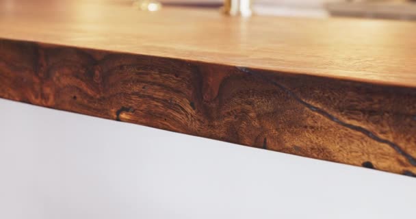 Close up dolly shot of the edge of a wooden countertop table with epoxy. — Wideo stockowe