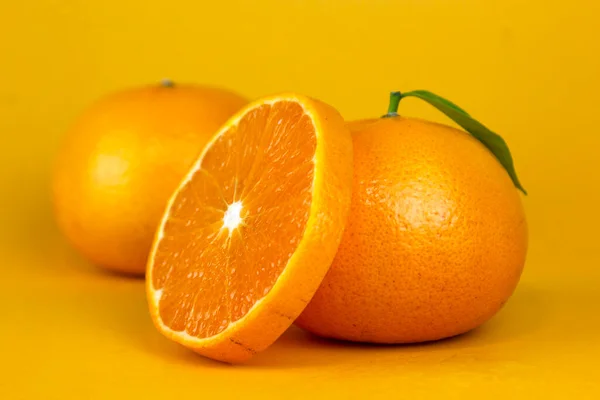 Juicy Orange fruit with leaf isolated. and Orang whole, slice, leaves on white. Orange slice with isolated on yellow background deign