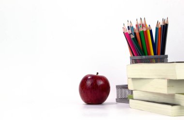 Education elements in the box with red apple and books isolated on white background. Back to school concept templates design