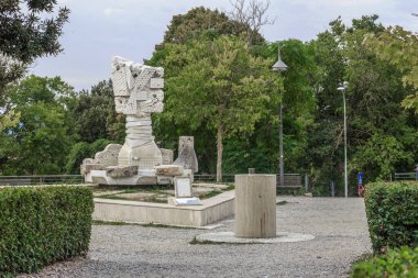 SAN GIMIGMANO, ITALY - SEPTEMBER 17, 2018: This is the modern Cinnamon Tree fountain (Maurizo Massini) in the park.