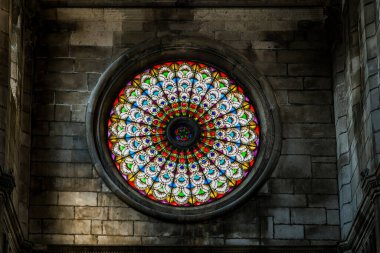 SIBENIK, CROATIA - SEPTEMBER 12, 2016: This is a stained glass rose window in the interior of the Cathedral of St. James, a UNESCO World Heritage Site.
