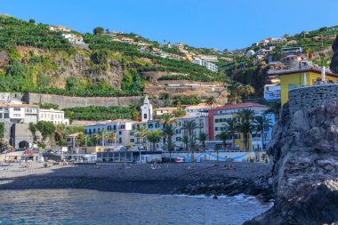 PONTA DO SOL, PORTUGAL - AUGUST 27, 2021: This is a view of the beach and waterfront of a small village in the southwest of Madeira.
