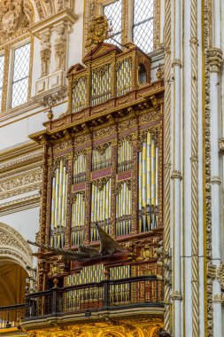 CORDOBA, SPAIN - MAY 23, 2017: This is the old organ in the interior of the Christian Catholic Cathedral of La Mesquita.