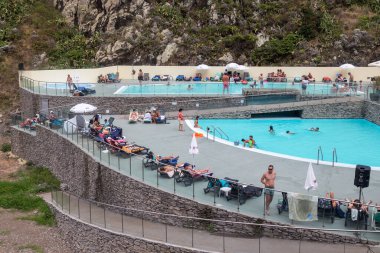 SAO JORGE, PORUGAL - AUGUST 21, 2021: Unidentified people are relaxing at the Calhau de Sao Jorge resort complex.