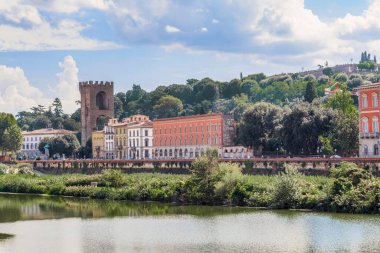 FLORENCE, ITALY - SEPTEMBER 18, 2018: This is the preserved tower of the gates of St. Nicholas of the city walls on the banks of the Arno River.