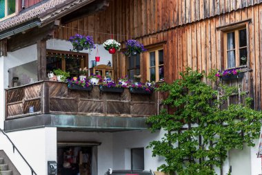 HALLSTATT, AUSTRIA - MAY 18, 2019: This is a fragment of a balcony of the old buildings of the famous Austrian town.
