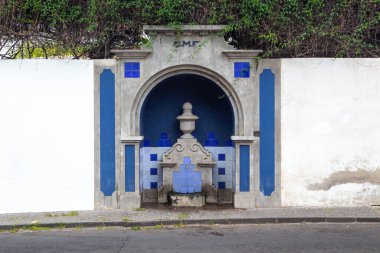 FUNCHAL, PORTUGAL - AUGUST 25, 2021: This is an old drinking fountain on one of the old city streets.