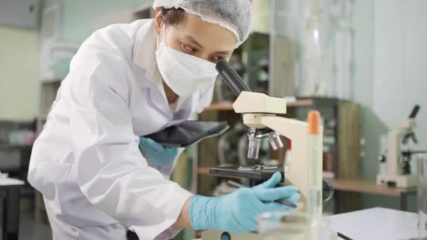 Young Female Scientist Lab Technician White Lab Coat Wearing Safety — Stockvideo