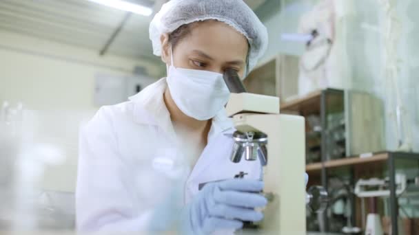 Young Female Scientist Lab Technician White Lab Coat Wearing Safety — Stockvideo