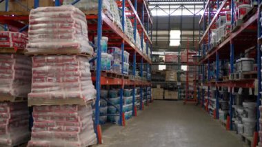 Chiang Mai, Thailand - 7 August 2022 -  Stock piles of home improvement products on industrial shelves in a warehouse storage