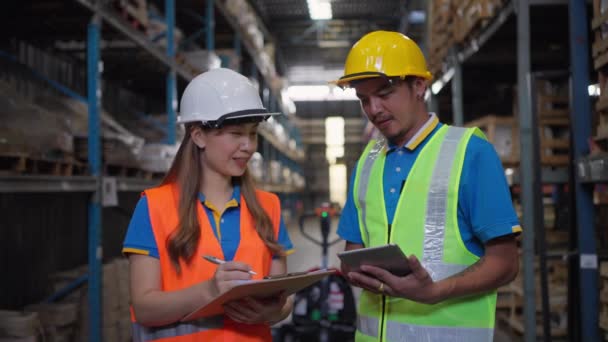 Two Male Female Warehouse Staff Working Together Check Inventory Company — Stockvideo