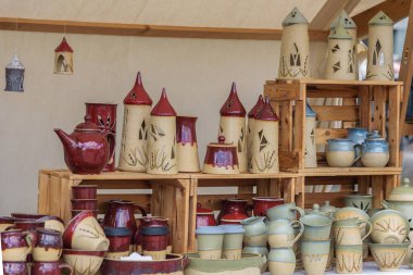 Magdeburg, Pottery Market - August 06, 2022: Handmade ceramic tableware. Individual household ceramics, cheerful ceramics, exquisite jewelry and art objects