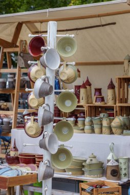 Magdeburg, Pottery market - 06 August 2022: Handmade ceramic cups. Individual utility ceramics, fun pottery, fine jewelry to artistic objects. Master potters and ceramists from Saxony-Anhalt