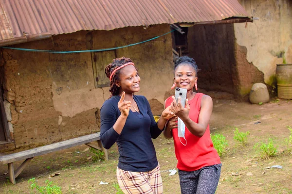 Two Happy African Women Ladies Friends Happily Look Smart Phone — Foto Stock