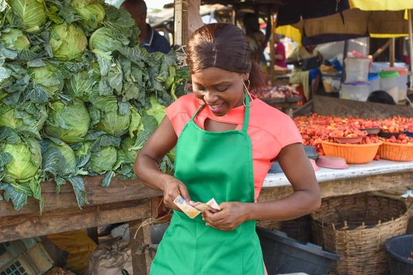 Happy African Business Woman Female Trader Wearing Green Apron Standing — Fotografia de Stock