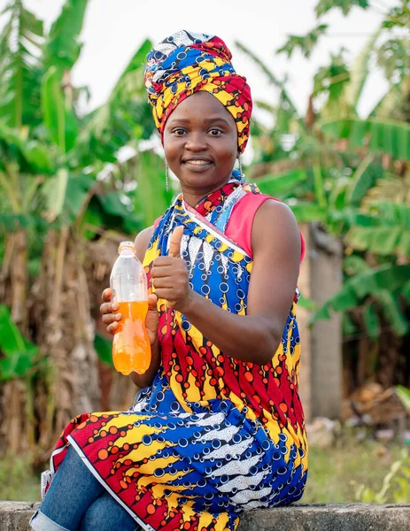 Beautiful African Lady Giving Thumbs While Holding Bottle Drink Her — Foto Stock