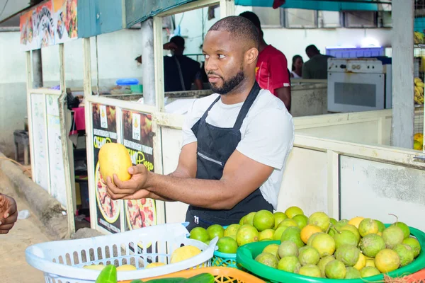 Male African Grocery Fruit Seller Tying His Apron Preparation Start — Φωτογραφία Αρχείου