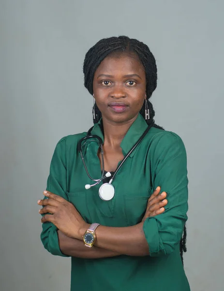 Female medical practitioner from Nigeria with stethoscope around her neck, doing thumbs up and representing medical practitioners like doctors, nurses, surgeon, physician,dentist among others