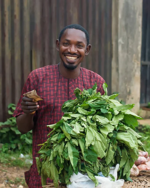 Nigerian Male Sales Person Trader Businessman Shop Owner Entrepreneur Holding — Stockfoto