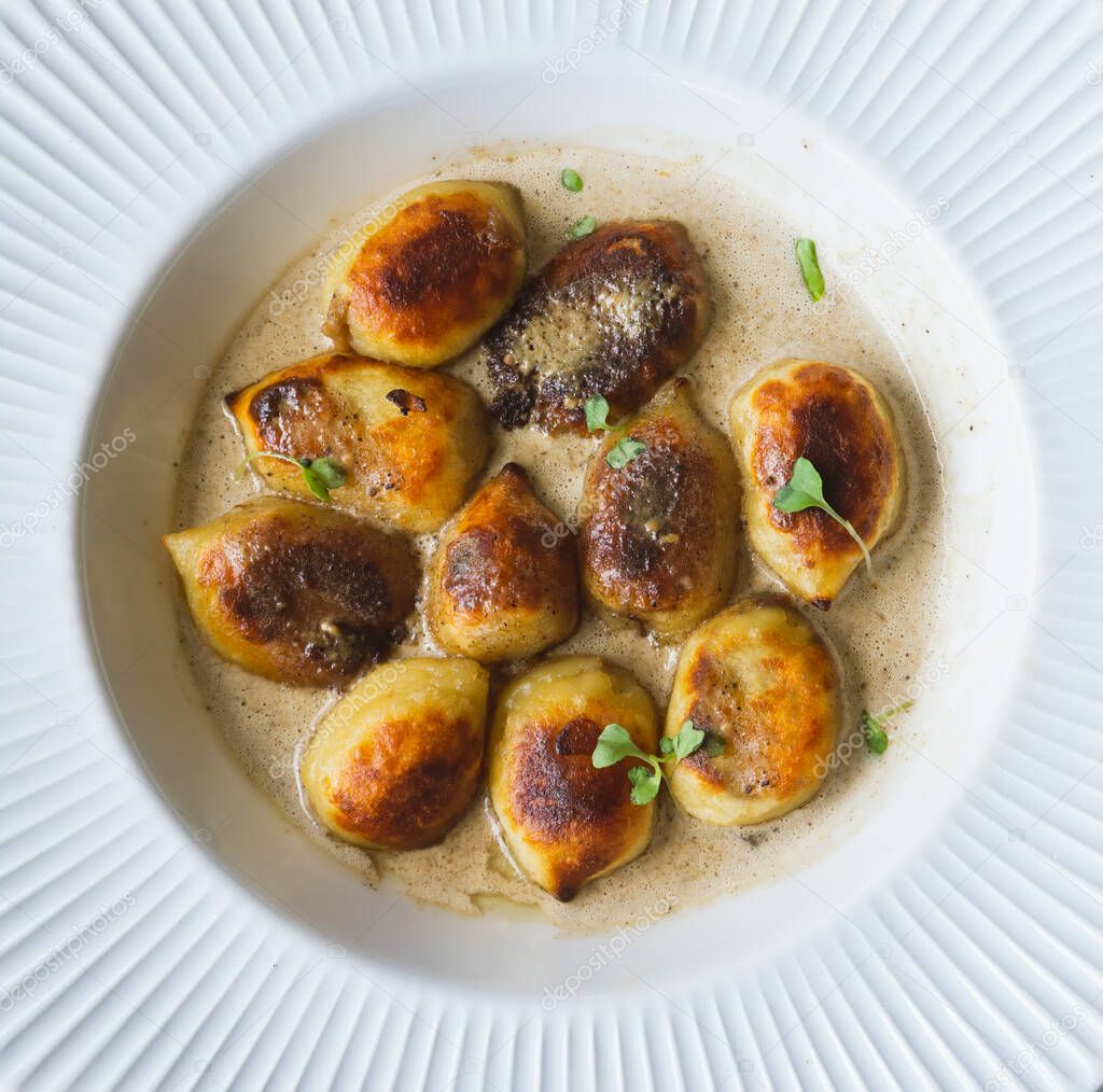 Crispy gnocchi stuffed with mushrooms(boletus edulis) with truffle sauce