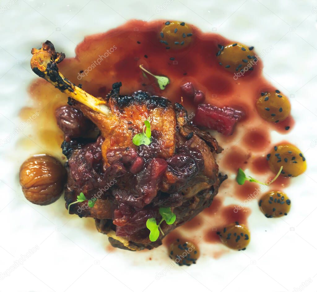 Duck confit with citrus sauce, chestnuts and fig sauce