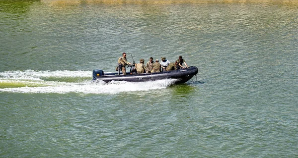 stock image Seville, Spain - May 31, 2019: Army boat over the Guadalquivir river during display of Spanish Armed Forces Day in Seville, Spain