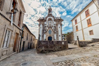 Strolling through the medieval streets of Tui. Tourism in Galicia. The most beautiful spots in Spain. Declared a Historic Artistic Site clipart
