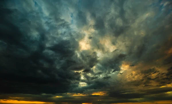 Awesome stormy sunset sky with dramatic colors. Climate background