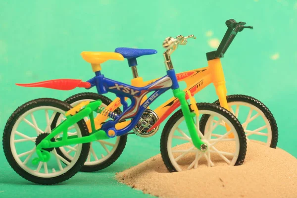 bike toy on green background ride fun children bike, toy, on green background, ride, fun, children,sand,beach ,play,summer,colorful,