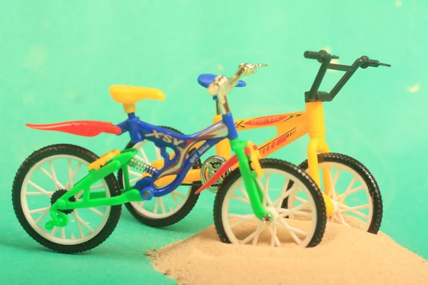 bike toy on green background ride fun children bike, toy, on green background, ride, fun, children,sand,beach ,play,summer,colorful,