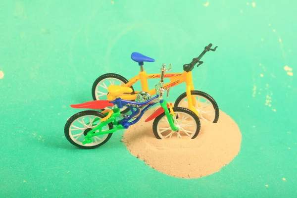 bike toy on green background ride fun children bike, toy, on green background, ride, fun, children,sand,beach ,play,summer,colorful,