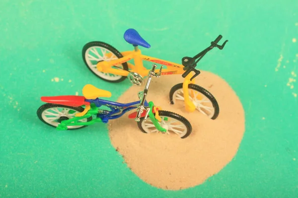 bike toy on green background ride fun children bike, toy, on green background, ride, fun, children,sand,beach ,play,summer,colorful,