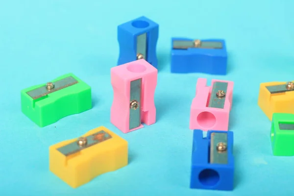 colorful plastic toy letters on blue background