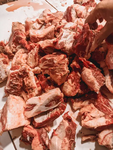 raw cuts of meat sold in traditional meat markets