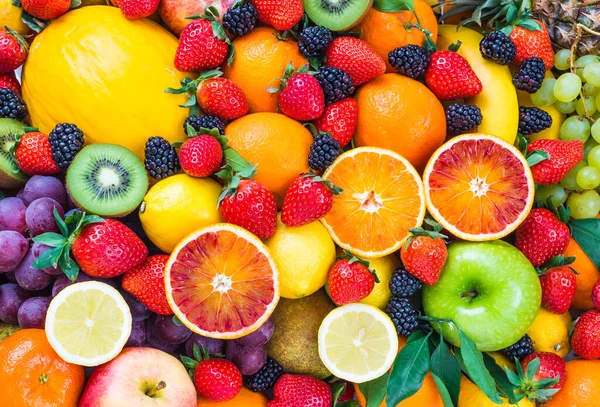 Fresh fruits assorted fruits colorful background.Vitamins natural nutrition concept.