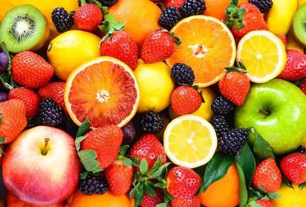Fresh fruits background.Juicy fruits variety natural nutrition.