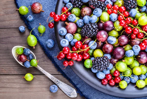 Berries fruits background. Antioxidants, detox diet, organic fruits background.