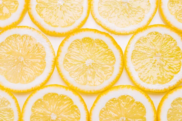 Lemon background.Slices of lemon yellow pattern background.