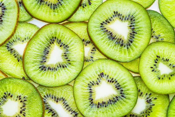 Kiwi fruits slices flat lay background.Green slices of kiwi fruits background.