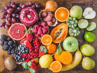 Fruits and berries rainbow top view.Natural vitamins and antioxidants food concept.