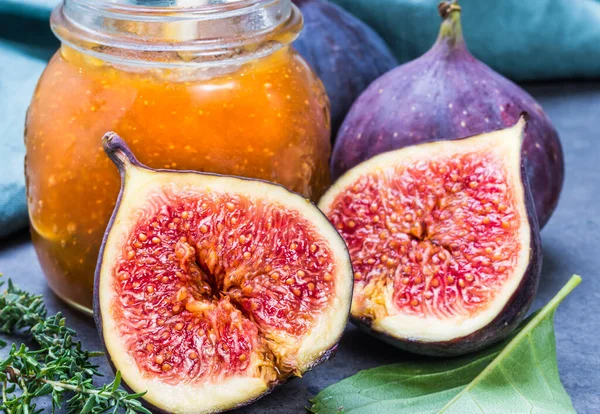 Figs jam or marmalade homemade preserves and fresh figs background.