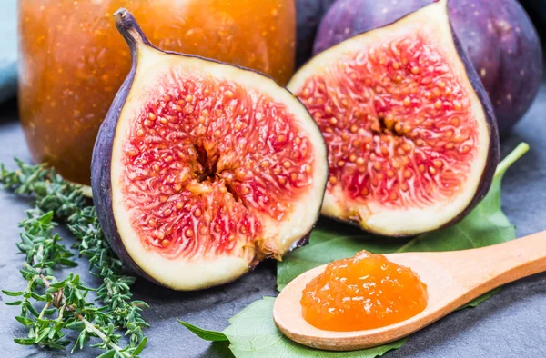 Figs jam or marmalade homemade preserves and fresh figs background.