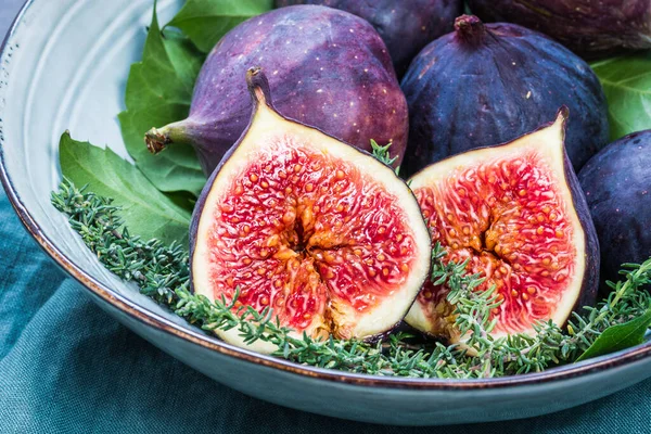 Figs jam or marmalade homemade preserves and fresh figs background.