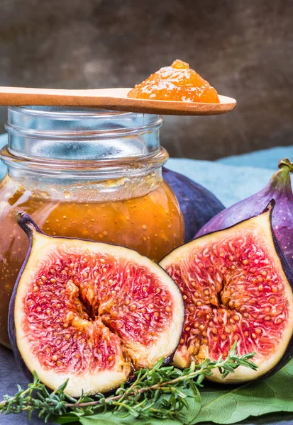 Figs jam or marmalade homemade preserves and fresh figs background.