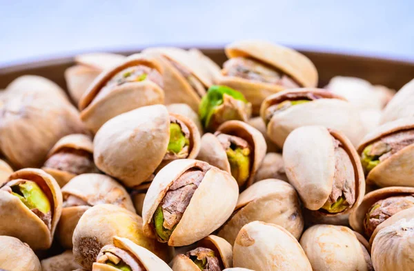 Pistachios close up copy space background.