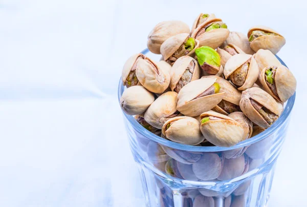 Pistachios close up copy space background.
